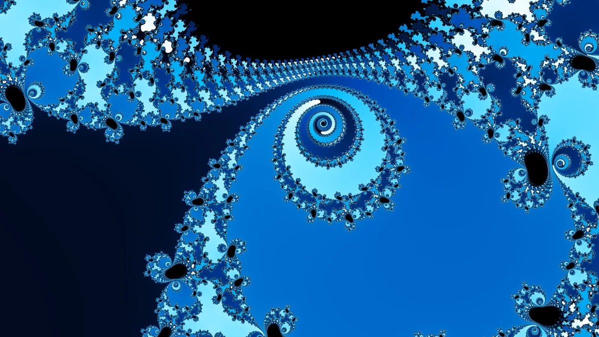A Julia set in bright blues, with a spiral at its centre and fine curled detail along the edges