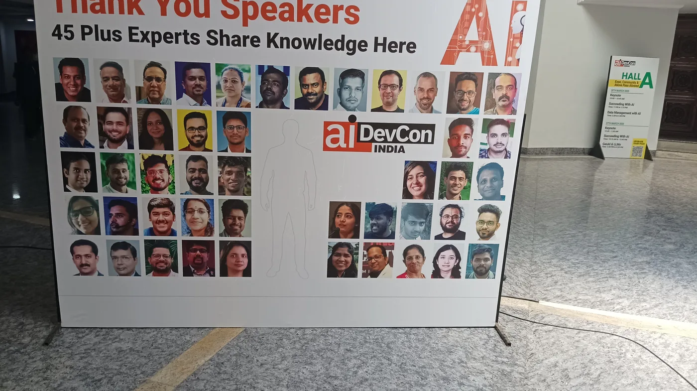 C Sarath Babu at AIDevCon India 2025. The Thank You Speakers board listing 45 plus experts