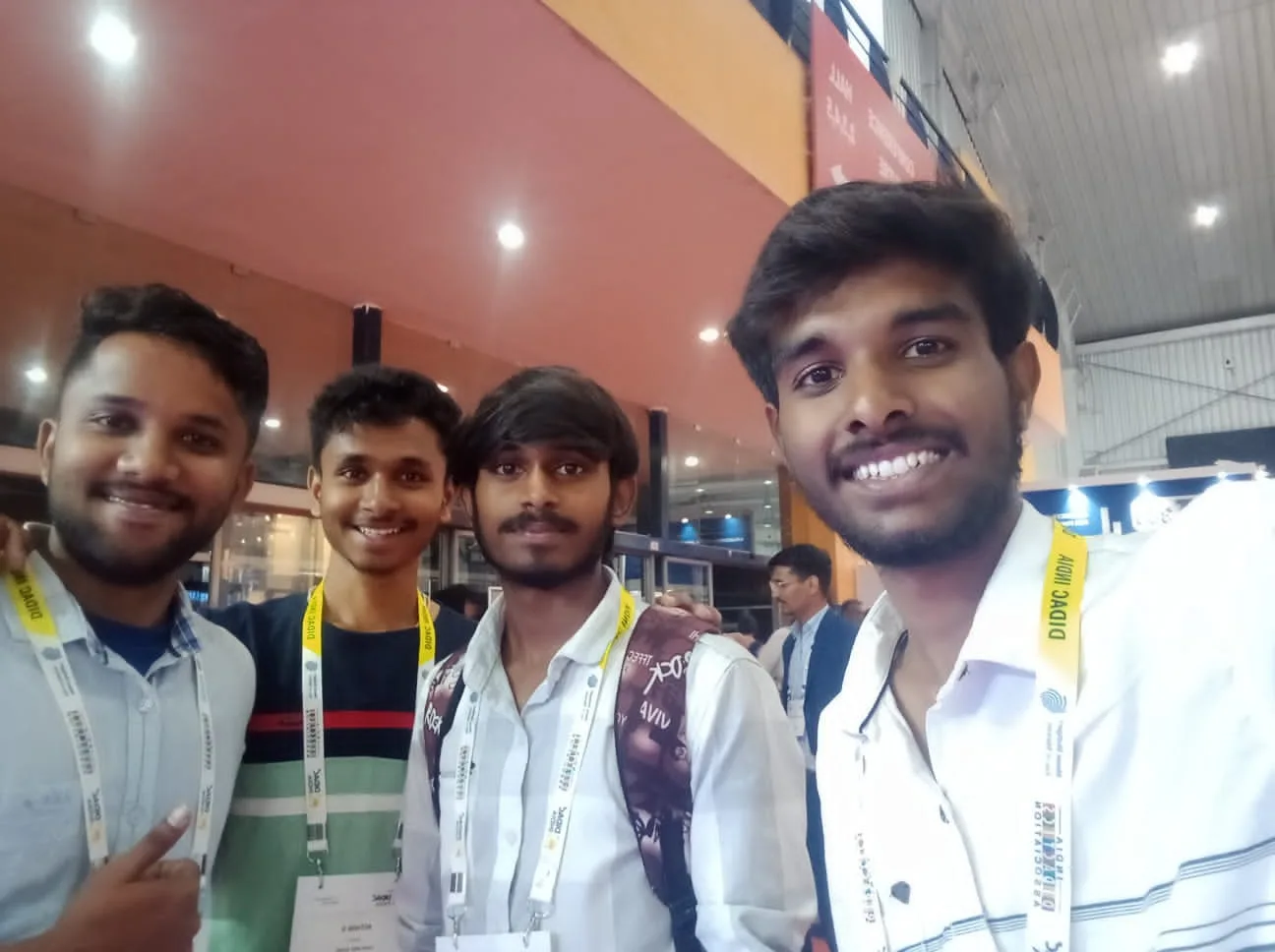 C Sarath Babu's writing on DIDAC INDIA 2023. Sarath, Pavan and Hemant with their friend at the exhibition