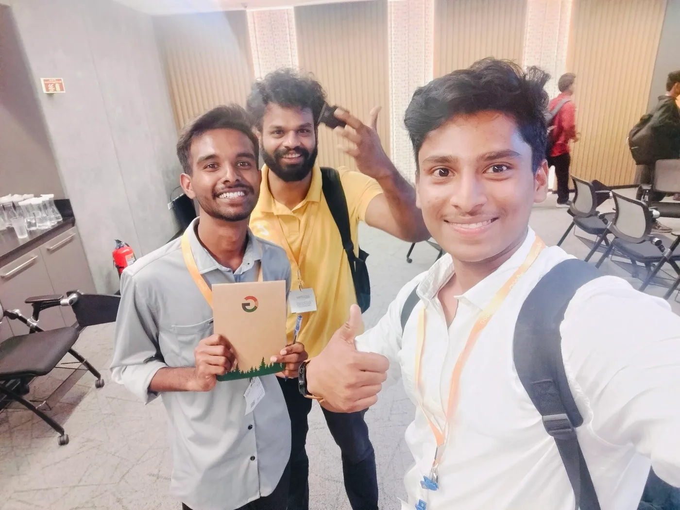 C Sarath Babu's writing on Google for Startups, 2024. Sarath with other founders at Startup School, holding a Google notebook