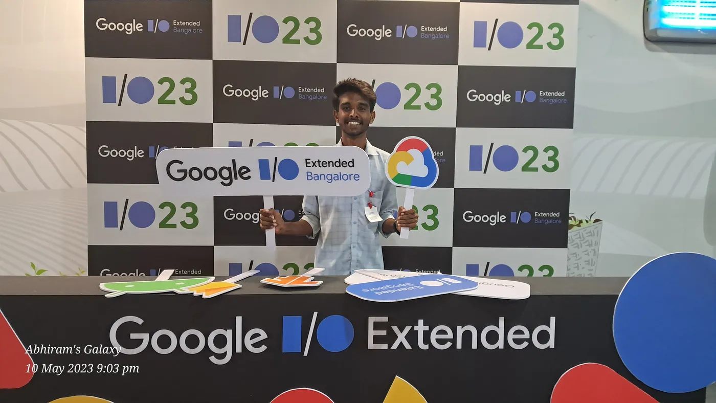 C Sarath Babu's writing on Google I/O Extended Bengaluru, 2023. Sarath holding a Google I/O Extended Bangalore sign at the photo wall