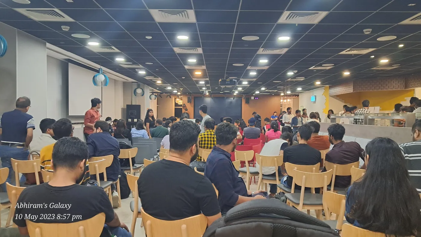 C Sarath Babu's writing on Google I/O Extended Bengaluru, 2023. The watch party hall filling up with attendees